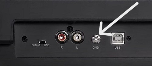 an image showing ground terminal or lug behind turntable