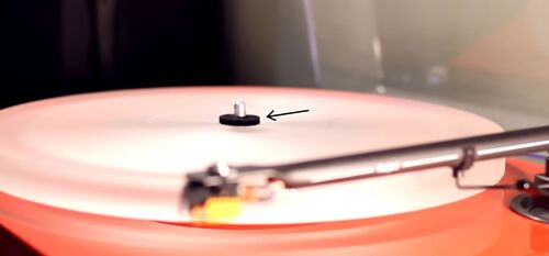 an image showing how to place felt washer over spindle