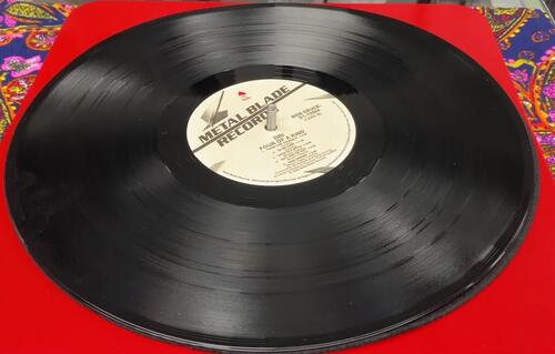 an image showing record resting on record pi metal plate