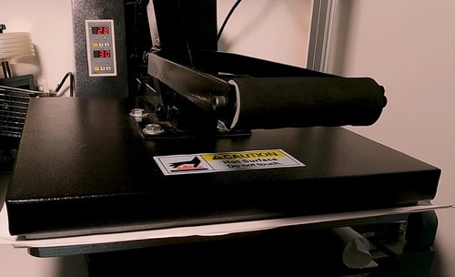 an image showing record pressed inside tshirt heating press